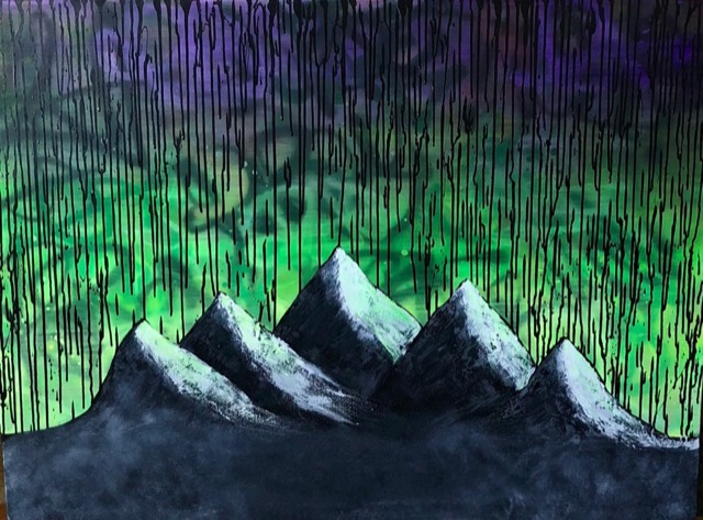 Peaks under a dripping sky